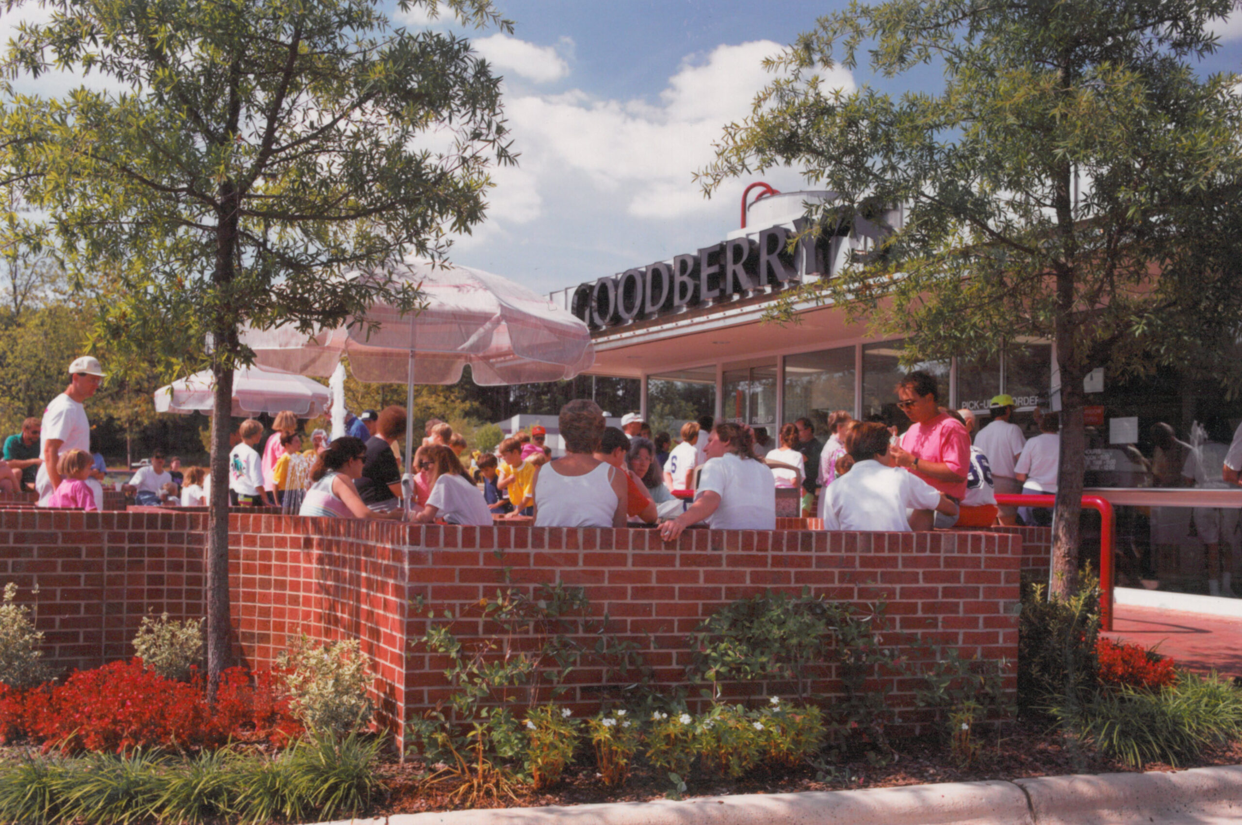 Guests gather in the courtyard on a sunny day at first Goodberry's, which opened September 1988 at the corner of Spring Forest Road and Atlantic Avenue in Raleigh